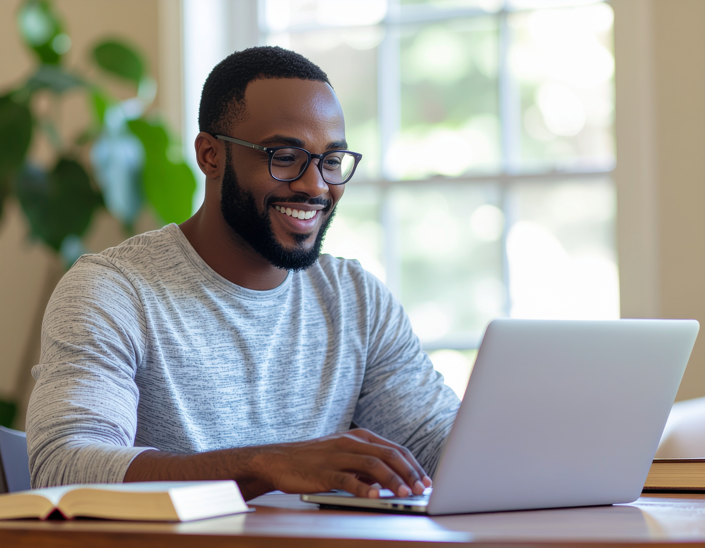 man preparing materials at his desk, resourceful and homey